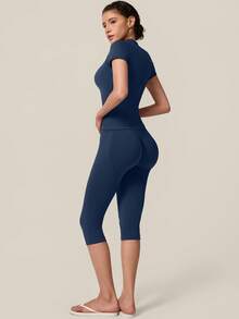 TimeOff Women's One Set Solid Color Seamless Round Neck Short Sleeve Ribbed Waist Mid-Length Pants Sports Set - Navy Blue - View 9