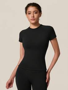 TimeOff Conjunto deportivo de mujer de un solo color sin costuras con cuello redondo, manga corta, cintura acanalada y pantalones de largo medio - Negro - Ver 9