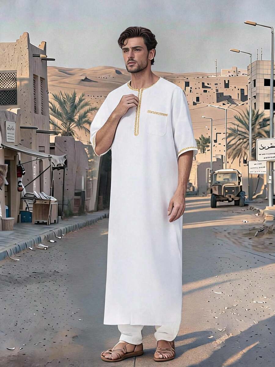Disqoir A Long Man's Arabian Robe With A Standing Collar And Pockets Set With Contrasting Gold Edges.
