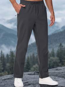 KEFITEVD Men's Winter Softshell Track Pants, Warm Fleece-Lined 4-Way Stretch Straight-Leg Sweatpants With Drawstring Waist And 3 Zip Pockets For Daily Wear - Dark Grey - View 1
