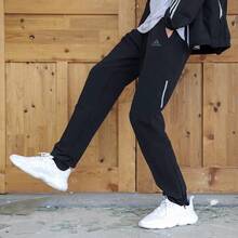 Celana Sweatpants Kasual Rajut dengan Resleting adidas Supernova untuk Pria - Hitam - View 2