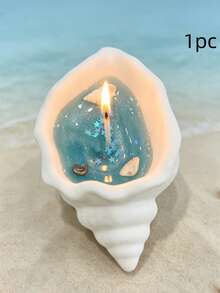 1件海洋風貝殼與海螺果凍香氛蠟燭，透明海藍色蠟體，裝飾貝殼、海星與細沙，點燃時呈現柔和燭光與清新海岸氛圍 - 多樣化香型 - 查看 9