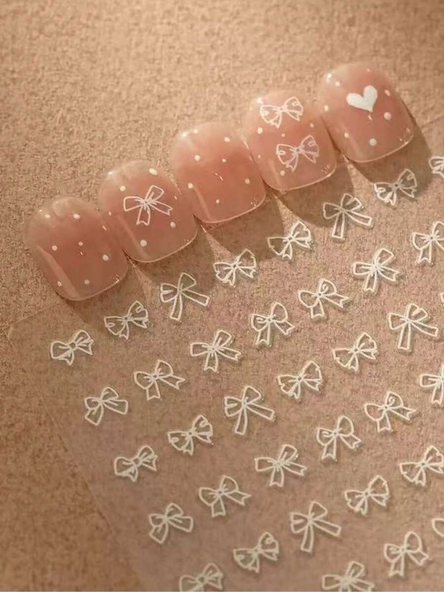1片極簡白色蝴蝶結美甲貼紙，細線蝴蝶結圖案，清新溫柔，薄透明設計，適合裸色與透明美甲顏色，韓系Ins性感風，小巧精緻，易貼附不易脫落，適用於凝膠美甲與手工穿戴甲DIY，打造乾淨溫柔的少女感美甲氛圍 - 彩色 - 查看 1