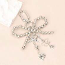 1pc Silver-Grey Faux Pearl Bow Pendant, Suitable For Women, Includes Faux Pearl And Heart-Shaped Pendant, Cute And Fashionable Keychain And Bag Accessory, Hollow Design - Silver - View 1
