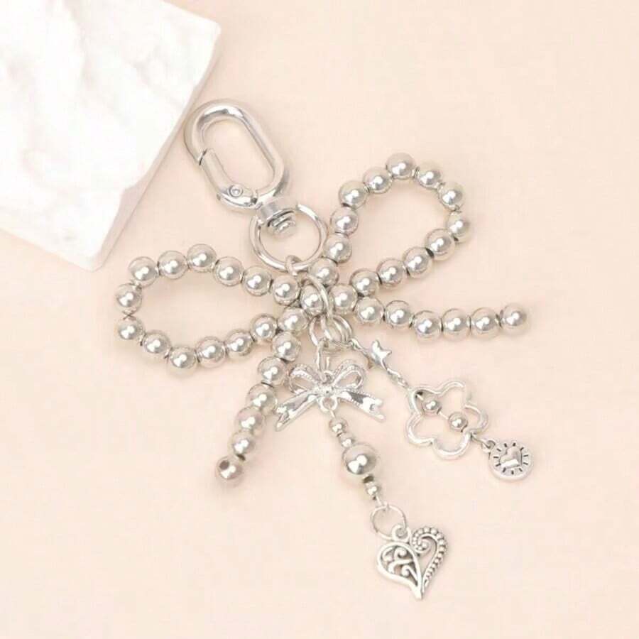 1pc Silver-Grey Faux Pearl Bow Pendant, Suitable For Women, Includes Faux Pearl And Heart-Shaped Pendant, Cute And Fashionable Keychain And Bag Accessory, Hollow Design - Silver - View 1