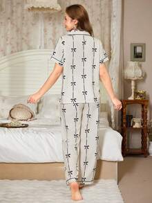 Women's Black Bow Print Pajama Set, Lapel Short Sleeve Button Front, Piped Straight Leg Pants Loungewear - Black and White - View 3