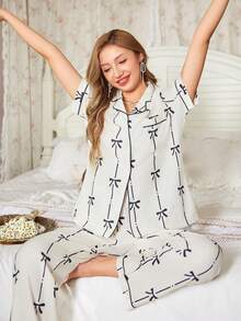 Women's Black Bow Print Pajama Set, Lapel Short Sleeve Button Front, Piped Straight Leg Pants Loungewear - Black and White - View 1