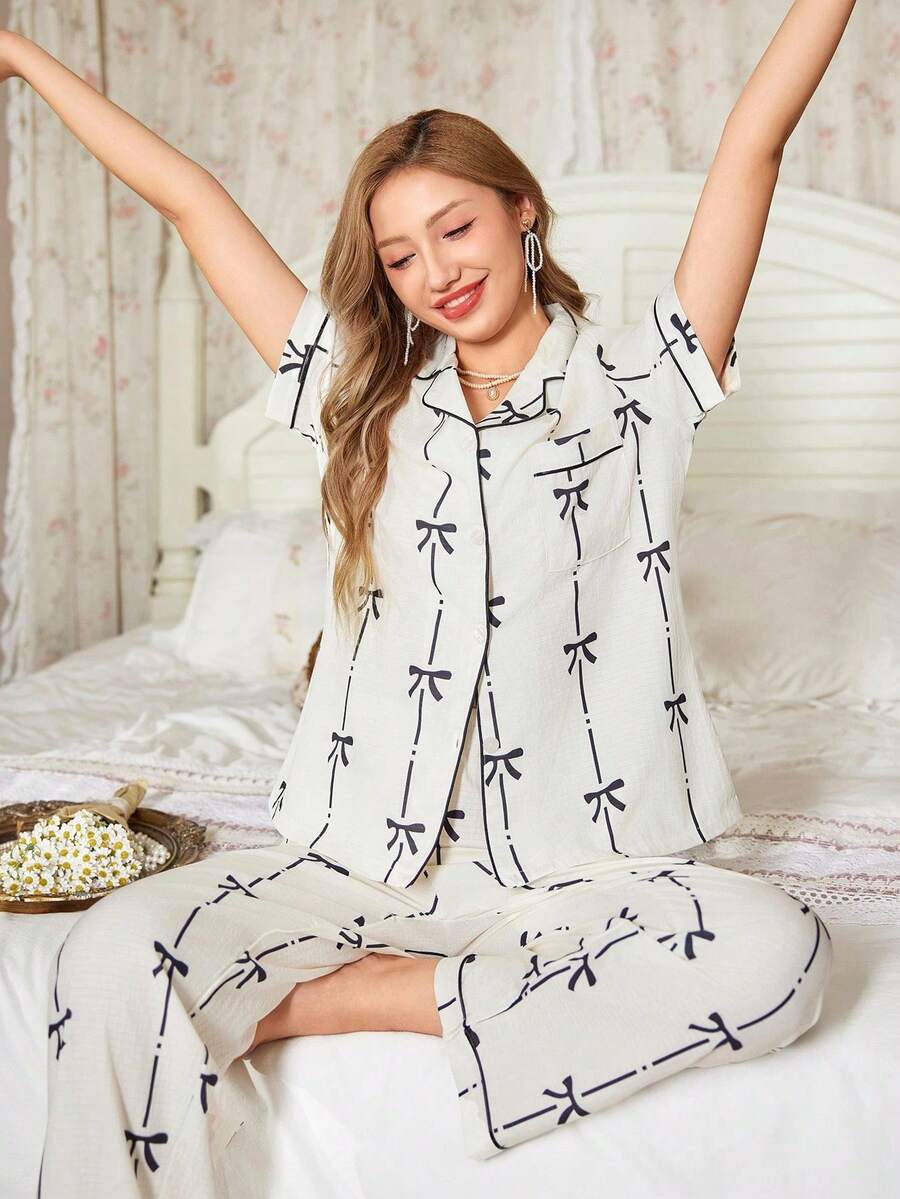 Women's Black Bow Print Pajama Set, Lapel Short Sleeve Button Front, Piped Straight Leg Pants Loungewear - Black and White - View 1