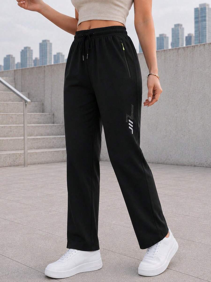 Women's Black Drawstring Jogger Pants With Zipper Pockets And Reflective Detail, Tapered Active Pants For Daily Wear - Black - View 1