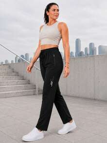 Women's Black Drawstring Jogger Pants With Zipper Pockets And Reflective Detail, Tapered Active Pants For Daily Wear - Black - View 5