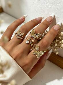 Set de 4 anillos apilables para mujer estilo Ins con mariposa y estrella de strass dorado, anillo multi-elemento con mariposa y pentagrama en forma de V totalmente de strass - Dorado - Ver 1