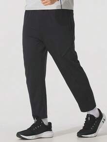 Under Armour Men's Sports Crop Cargo Pants, Knit Straight Leg Trousers For Daily Running, 1386979-001 - Black - View 2