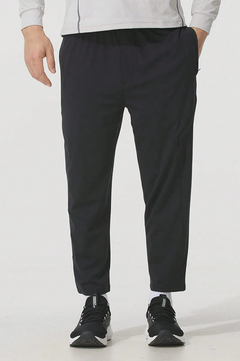 Under Armour Men's Sports Crop Cargo Pants, Knit Straight Leg Trousers For Daily Running, 1386979-001 - Black - View 1