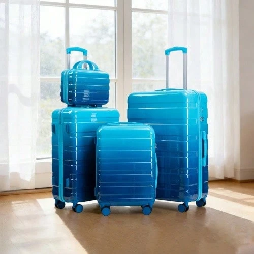 مجموعة حقائب سفر دوارة من البولي كربونات 4 قطع مقاسات 14"/20"/24"/28" – أحجام كبيرة ومتوسطة وصغيرة مع مقابض جانبية وأقدام واقية – قفل مدمج برقم سري وحقيبة مستحضرات تجميل 14" (أزرق) - مشاهدة 1