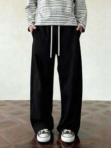 Men's Black Wide Leg Sweatpants New Casual Straight Leg Long Pants, Contrast Beige Drawstring Waist Design, Loose Drape Fit Flattering For All Body Types, Slimming And Leg-Lengthening, Side Pockets Practical For Storing Small Items. Soft Skin-Friendly Knit Fabric, Comfortable And Pill-Resistant, Suitable For Daily Commute, Streetwear, Home And Travel, Versatile All-Match Style, Pairs Well With T-Shirts, Sweatshirts And Sneakers, Simple Solid Color Durable And Timeless, Essential Casual Long Pants For Men. - Black - View 9