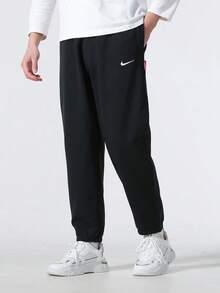 Nike Sportswear Men's Casual Pants, Soft, Breathable, Versatile, And Comfortable For Outdoor Wear - Black - View 1