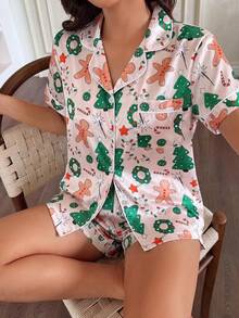 Julpyjamas för kvinnor, 2-delat set i satin med julgran- och pepparkaksman-motiv, kortärmad topp med krage och shorts med rosett - Aprikos - Visa 6