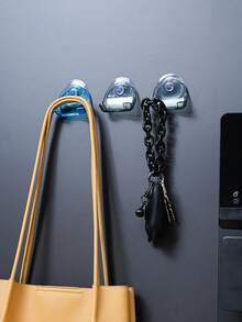 A Wall-Mounted, Multi-Functional Suction-Cup Holder Made Of Durable Plastic. It Features Strong Suction And A Non-Slip Design, Making It Suitable For Installation On Bathroom Or Kitchen Walls To Store Items Such As Razors And Towels. - Multicolor - View 8