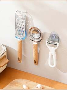 A Wall-Mounted, Multi-Functional Suction-Cup Holder Made Of Durable Plastic. It Features Strong Suction And A Non-Slip Design, Making It Suitable For Installation On Bathroom Or Kitchen Walls To Store Items Such As Razors And Towels. - Multicolor - View 3