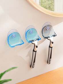 A Wall-Mounted, Multi-Functional Suction-Cup Holder Made Of Durable Plastic. It Features Strong Suction And A Non-Slip Design, Making It Suitable For Installation On Bathroom Or Kitchen Walls To Store Items Such As Razors And Towels. - Multicolor - View 7