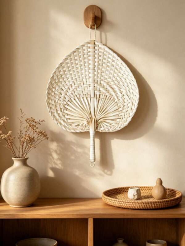 A 15cm Wide Hand-Woven Heart-Shaped Fan With A Unique Peach-Shaped Decorative Accent. Ultra-Thin And Lightweight, Suitable For Both Indoor And Outdoor Use As A Handheld Fan For Cooling Off.