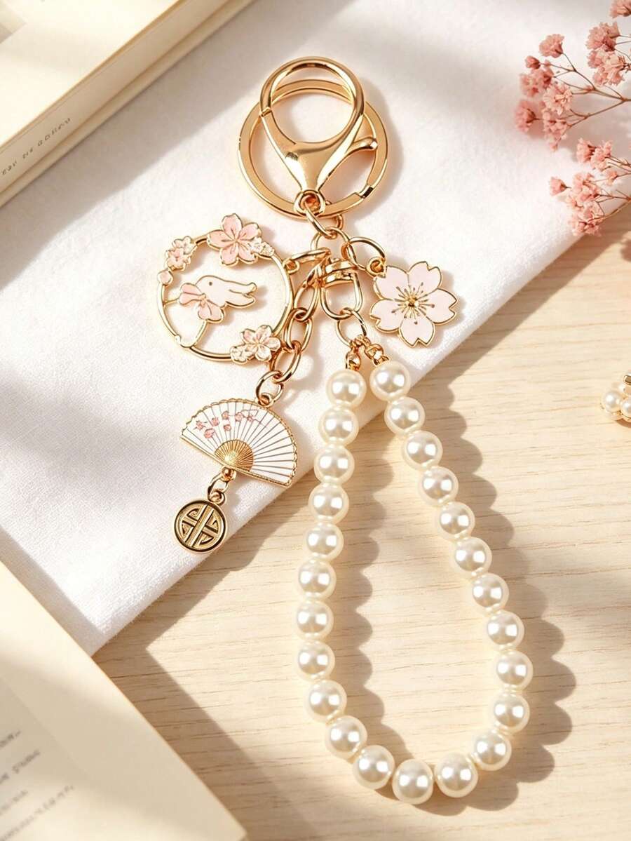 1件女款時尚珍珠櫻花鑰匙圈,簡約背包吊飾,DIY優雅仿珍珠串珠鑰匙圈,背包耳機殼裝飾掛件 - 淺粉色 - 查看 1