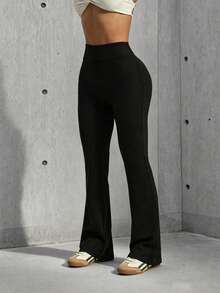 Hidkat Women's Solid Color High Waist Back Criss-Cross Waistband Elastic Band Fitted Sports Knit Flare Pants - Black - View 3