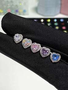 Pendientes de corazón con diamantes