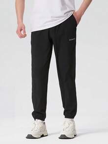 Columbia Men's Outdoor Comfortable Breathable Minimalist Tapered Leg Casual Woven Long Pants - Black - View 1