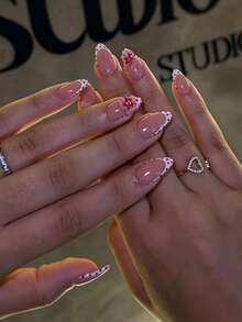 24片短杏仁形穿戴甲，裸粉色法式假指甲，紅色波點邊框3D櫻花花朵設計，亮面可重複使用美甲，溫柔甜美女性日常美甲，飾有精緻手繪3D櫻花花朵配金黃花蕊與鋼珠，法式白色邊緣，波點美甲，女性日常美甲配件，適合日常通勤、購物、婚禮、生日派對、旅遊攝影、約會等場合，也是偏好溫柔風格美甲女孩與女性的絕佳禮物選擇 - 紅色 - 查看 9