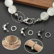 600 st DIY-assortiment av kopplingsringar och delar, inklusive hoppringar och spännen, lämpligt för flätning, DIY-smycken, halsband, armband, nyckelringar, pärlkopplingar, ändkapslar, avslutningsspännen, öppna hoppringar och smyckespännen, tillbehörsmaterial för smyckestillverkning - Knapp & ögla - Visa 8