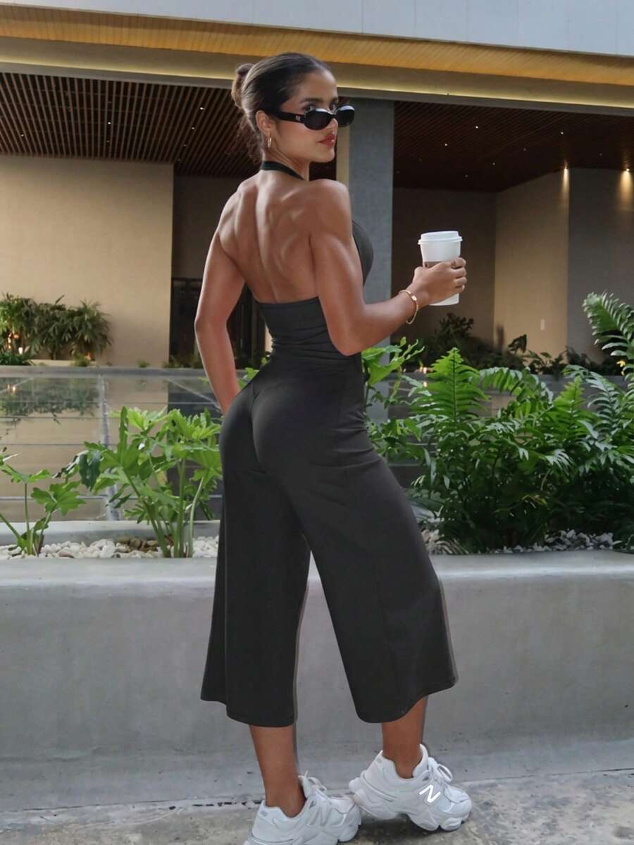 Women's 2-Piece Black Ribbed Halter Backless Yoga Set, Ruched U-Neck Top + High-Waisted Cropped Flare Pants, Elastic Breathable Shaping Workout Outfit - Black - View 1
