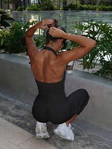 Women's 2-Piece Black Ribbed Halter Backless Yoga Set, Ruched U-Neck Top + High-Waisted Cropped Flare Pants, Elastic Breathable Shaping Workout Outfit - Black - View 2