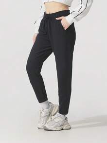 Under Armour Pantalones deportivos casuales ligeros de exterior de punto de felpa otomana para mujer 1379778-001 - negro - Ver 2