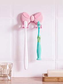 1pc Bow-Shaped No-Drill Toothbrush Holder, Multi-Functional Home Storage Rack - Pink - View 1