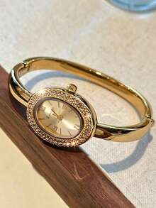 1pc Women's Oval Rhinestone Gold Bracelet Quartz Watch, Metallic Dial With Roman Numerals, Bezel Inlaid With Sparkling Rhinestones, Polished Open Bangle Wristwatch, Gold Jewelry, Summer Accessory. Suitable For Daily Commute, Summer Outings, Holiday Parties, Weddings, Back To School Season, Matches Various Outfits, Perfect Gift For Women, Exquisite And Sparkling, Elegant And Luxurious - Gold - View 1