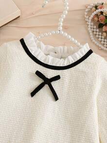 Girls French Style Tweed Dress, Cream Textured Tweed Fabric, Ruffle Collar With Black Satin Bow, Contrast Black Trim Cuffs, Double Pockets With Exquisite Pearl Chain Embellishment, Loose A-Line Silhouette - Apricot - View 5