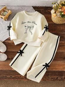 2pcs Baby Girls Autumn Handwritten Letter Bow Print Long Sleeve Sweatshirt Set, Contrast Color Webbing 3D Bow Decor Elastic Wide Leg Pants, Champagne Street Style Fashion Cute Children Spring Fashion Outfit - Champagne - View 1