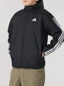 Jaket adidas Essential 3-Stripes Ripstop Windbreaker Series Sport Striped Hooded Zip-Up Waterproof Windproof Long-Sleeve Jacket for Men - Hitam - View 1