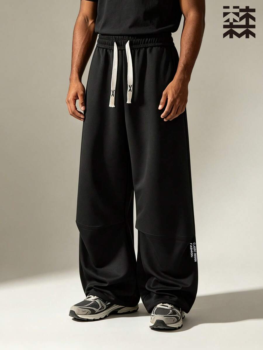 mulinsen Men's Comfortable Skin-Friendly Breathable Drape Casual Pants, Loose Fit Versatile, Pleated Design Elastic Waist Pants - Black - View 1