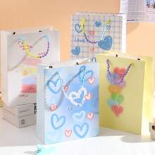 4Pcs Heart Pattern Paper Gift Bags, Colorful Bead Handle Shopping Tote Bags, Reusable Party Favor Present Packaging Bags - View 2