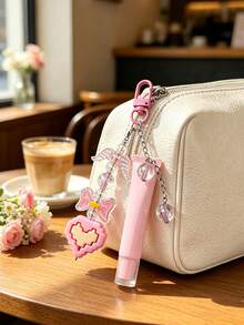 15ml Slanted Mouth Lipstick Tube With Pink Pixel Heart Shaped Keychain, Angel Wings And Rainbow Color Transparent Beads Pendant, Multi-Functional Bag Charm, Refillable Cosmetic Container, Squeeze Dispenser Bottle, Lip Gloss Keychain, Beauty Tool, Lipstick Bag Charm, Birthday, Back To School Gift, Graduation Gift, Wedding Accessory - Multicolor - View 1