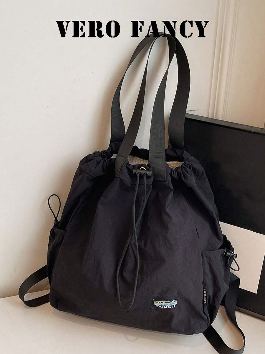 一款小巧精致、功能齐全的休闲手提包，纯色设计，简约风格，大容量，便携女包，适合日常通勤、旅行、购物和上学等场合。