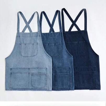 A Short Denim Apron With Multiple Front Pockets And An Adjustable Neck Strap, Suitable As A Work Apron For Female Gardeners, Painters, Staff, Nail Artists, Hairdressers, And Coffee Shop Workers. It's A Ladies' Apron But Also Works For Men.