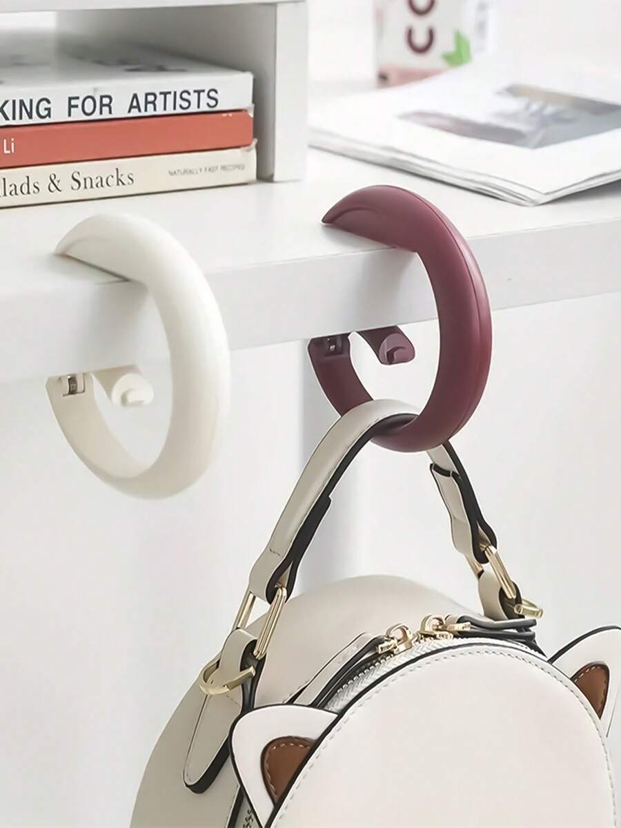 1pc Creative Drill-Free Bag Hooks, Foldable Handbag & Wallet Hooks, Floating Table Mounts, Non-Marking Plastic, Practical Hooks. Suitable For Home, Office, School, Christmas Gifts. Easy To Use And Portable.