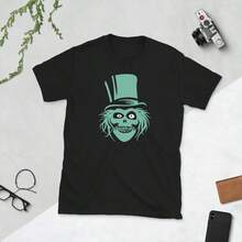 Black Short-Sleeve T-Shirt With Teal Top Hat Ghost Face Graphic, Set On White Surface With Desk Items.Fall Tops Women - Black - View 1