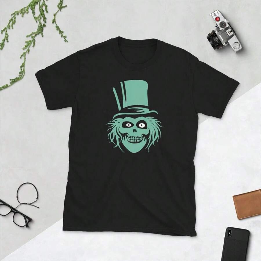 Black Short-Sleeve T-Shirt With Teal Top Hat Ghost Face Graphic, Set On White Surface With Desk Items.Fall Tops Women - Black - View 1