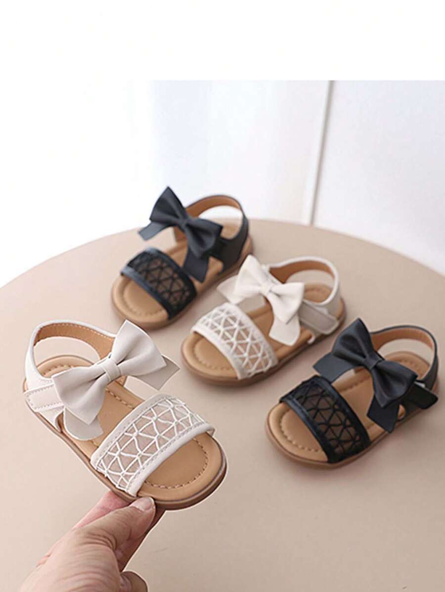 1 Pair Girls' Summer Hollow Bow Knot Sandals, Hook-And-Loop Buckle, Soft Sole, Anti-Slip, Princess Style, Open Toe, Beach Shoes - Black - View 1