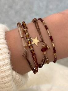 4pcs Vintage Bohemian Style Resin Woven Seed Bead Gold Star Pendant & Small Bell Decor Layered Bracelet Set, Suitable For Women Daily Wear, Autumn, Cafe, Travel, Photography, Gift - Brown - View 1