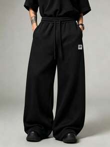 Unisex Split Seam Wide Leg Sweatpants, Comfortable Knit Sports Fabric, White Contrast Drawstring, Small STAR LIGHT Letter Patch On Waist Side, 3D Cut Loose Wide Leg Casual Long Pants, Available In Multiple Colors - Black - View 5